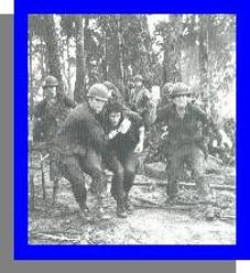 A wounded U.S. paratrooper is rushed to safety