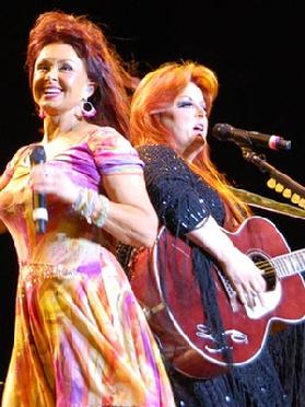 The Judds were an American country music duo composed of Naomi Judd and her daughter, Wynonna. The Judds signed with RCA Records in 1983 and were one of the most popular country music duos of the decade, recording more than ten studio albums and charting many hit singles on the Billboard Hot Country Singles (now Hot Country Songs) charts, including fourteen Number Ones. From 1984, every album was a collaboration with producer Brent Maher and the prolific Nashville musician Don Potter. Click Here for more...