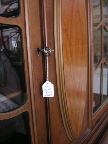 A circa 1920's walnut China Cabinet from H.E. Shaw Furniture Co. Manufacturers from Grand Rapids, Michigan.