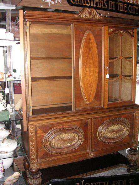 A circa 1920's walnut China Cabinet from H.E. Shaw Furniture Co. Manufacturers from Grand Rapids, Michigan.
