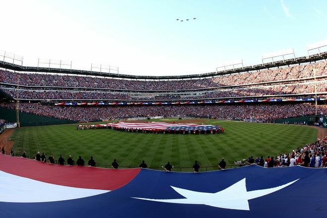 ARLINGTON, TX - OCTOBER 30: A general view of Jets while they perform a fly over as giant American Flag stretched across the ouitfield during pregame festivities between the Texas Rangers and the San Francisco Giants in Game Three of the 2010 MLB World Series at Rangers Ballpark in Arlington on October 30, 2010 in Arlington, Texas...