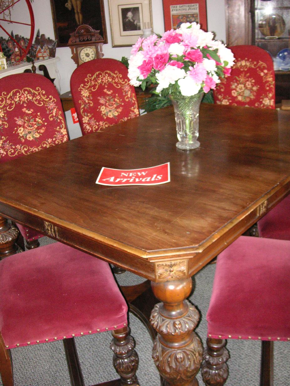 A circa 1920's walnut dining room table from H.E. Shaw Furniture Co. Manufacturers from Grand Rapids, Michigan.
